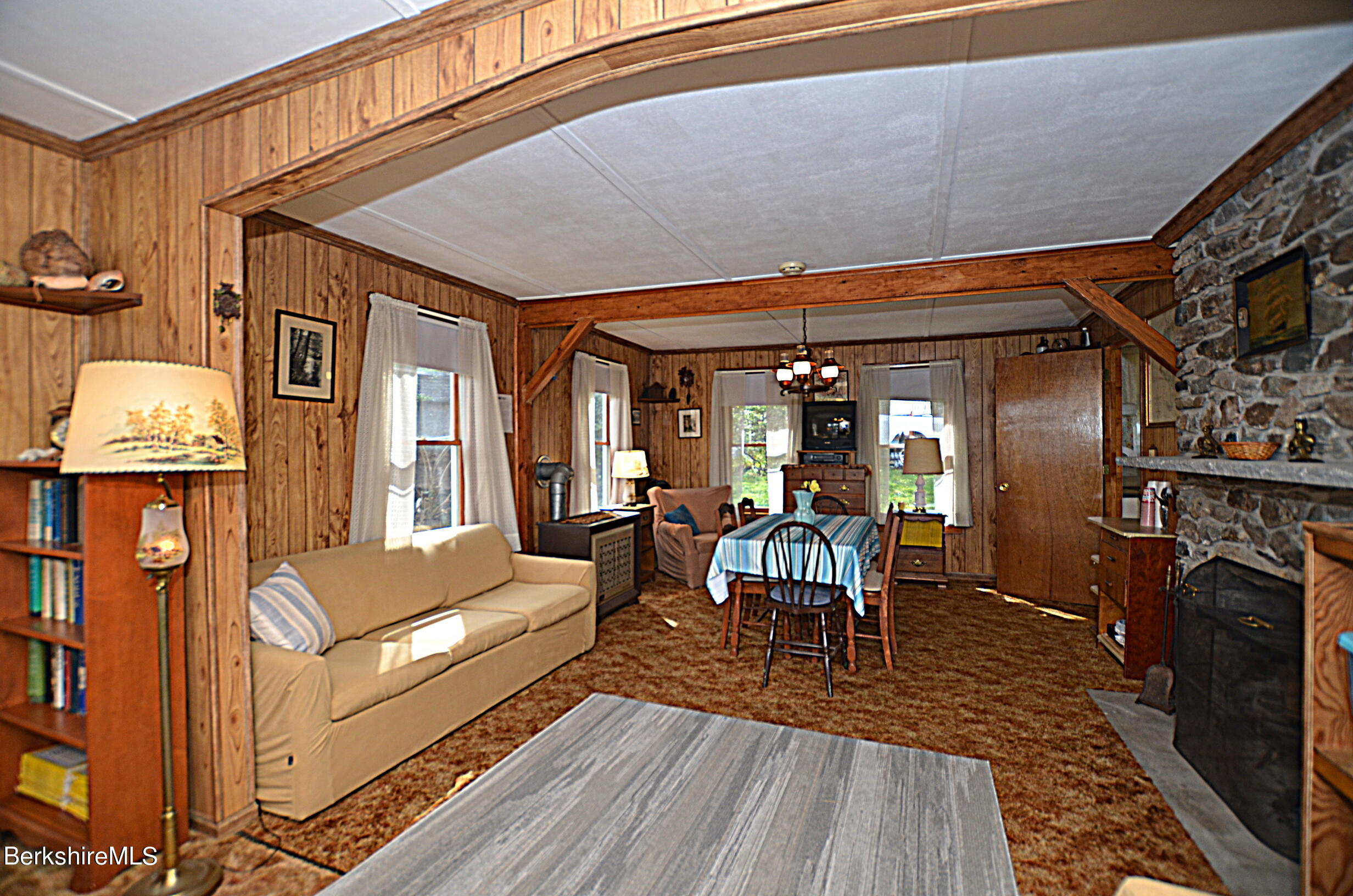 71 Flint Farm Road Otis, MA 01029 - Photo 15 of 21 a dining room with furniture and wooden floor