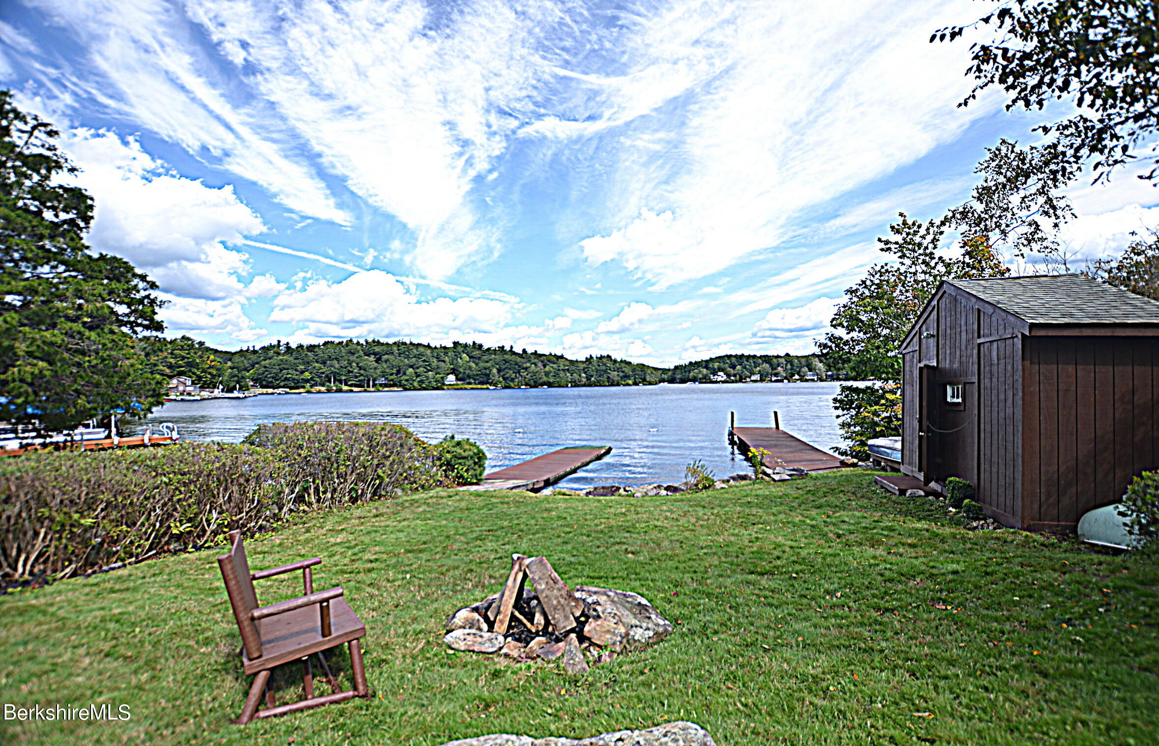 71 Flint Farm Road Otis, MA 01029 - Photo 5 of 21 a view of a lake with a house in the background