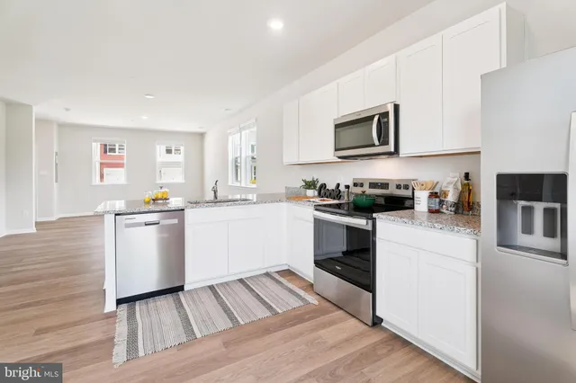 a view of an entryway with wooden floor and a window