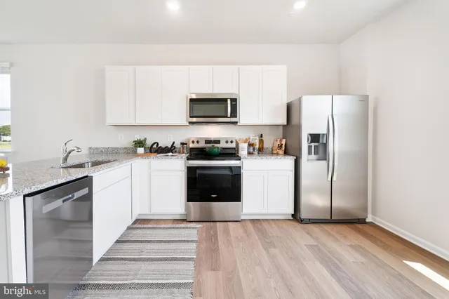 a bathroom with a sink a mirror and toilet