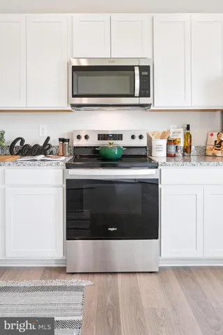 a bathroom with a sink a mirror and vanity