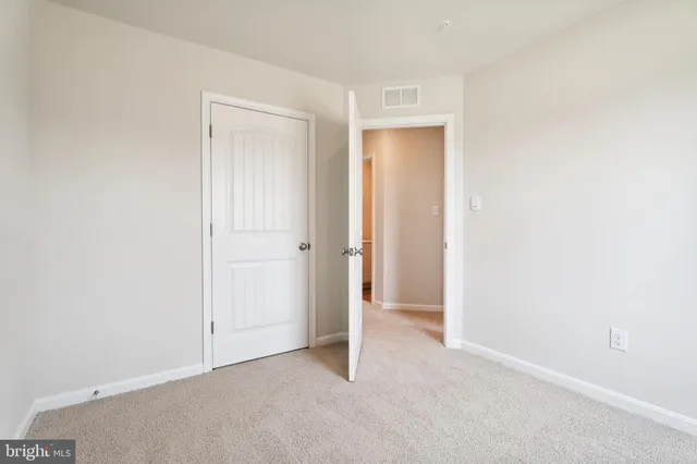 wooden floor and white cabinet in a room