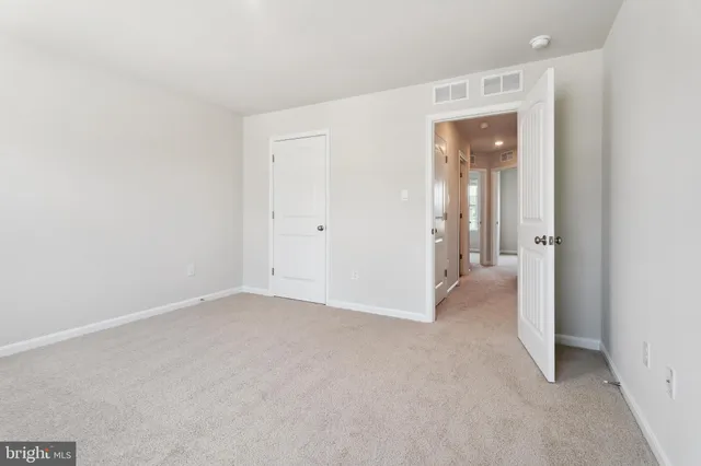 a white toilet sitting next to a bath tub