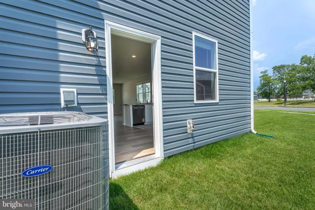 a view of a backyard with plants and a backyard