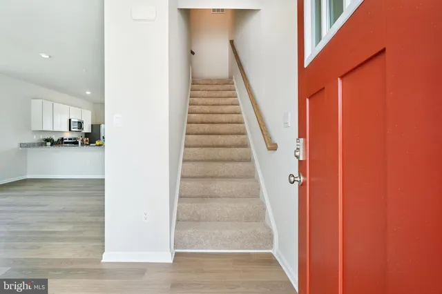 a view of a kitchen with a sink and a window