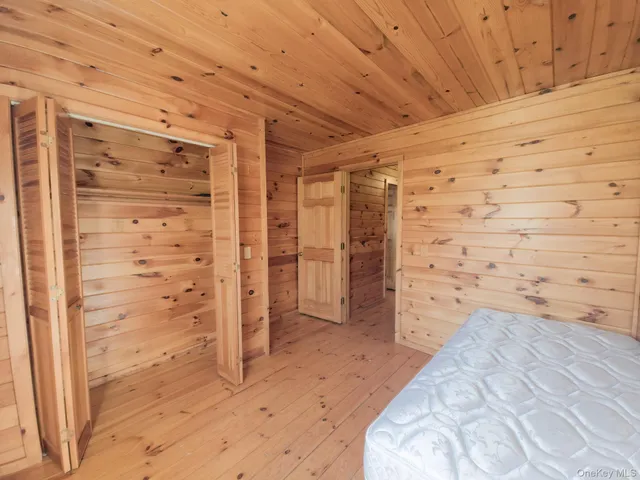 a front view of a house with a garden and plants