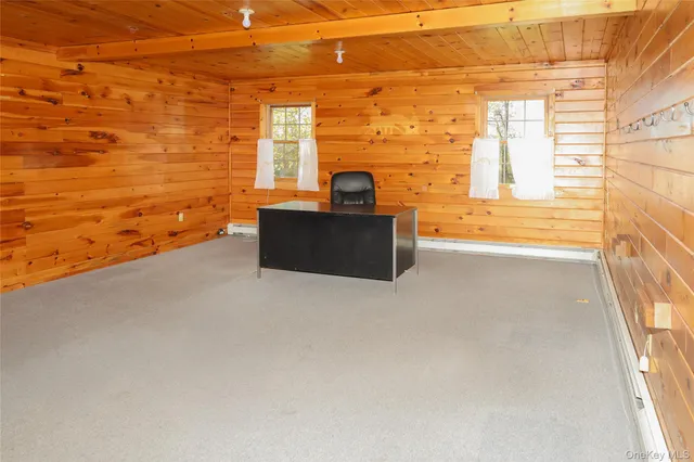 a view of a large tree with a yard