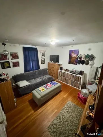 a bedroom with furniture and a book shelf