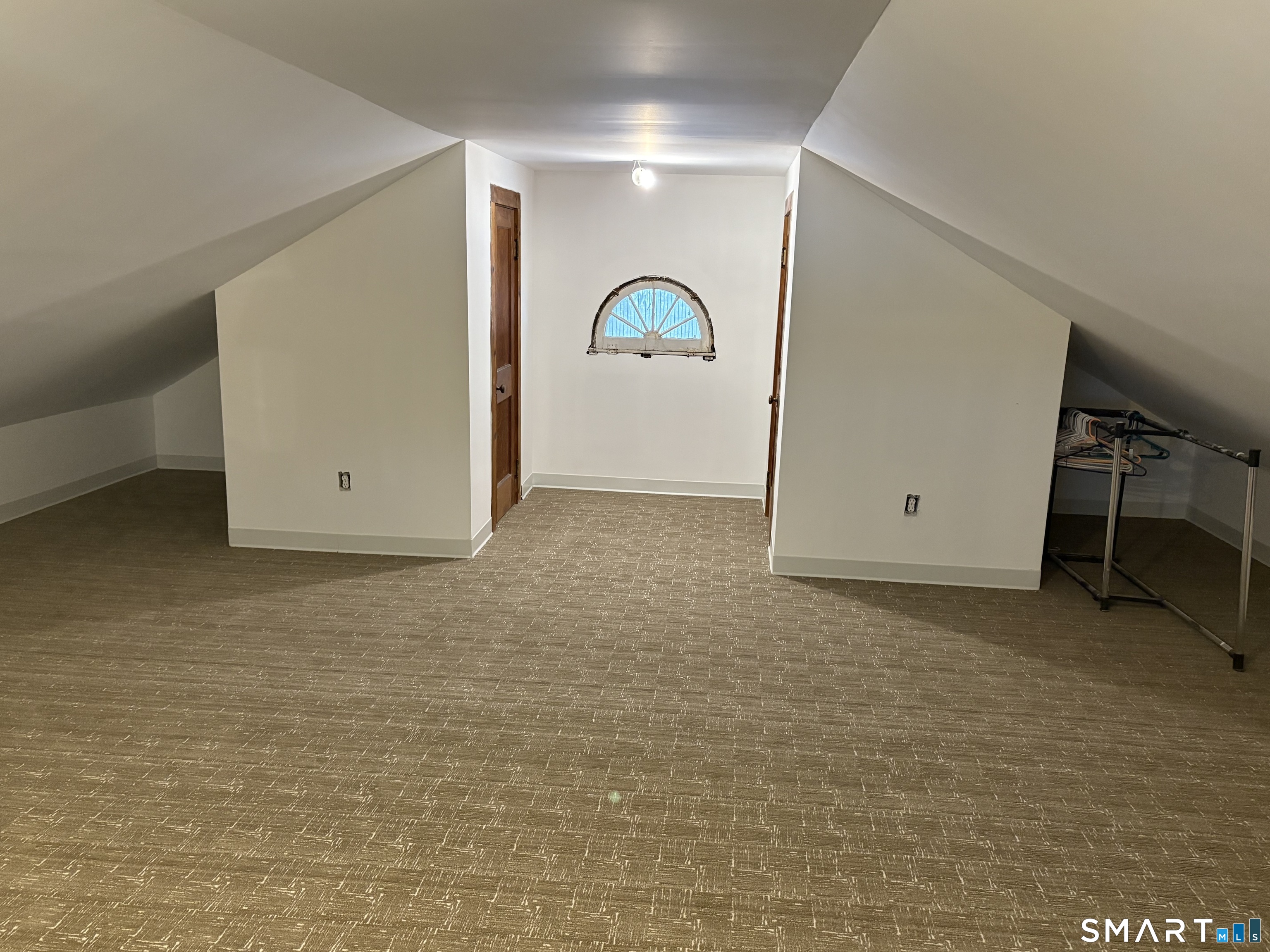 249 Canaan Road Stratford, CT 06614 - Photo 14 of 14 a room with a desk and potted plant