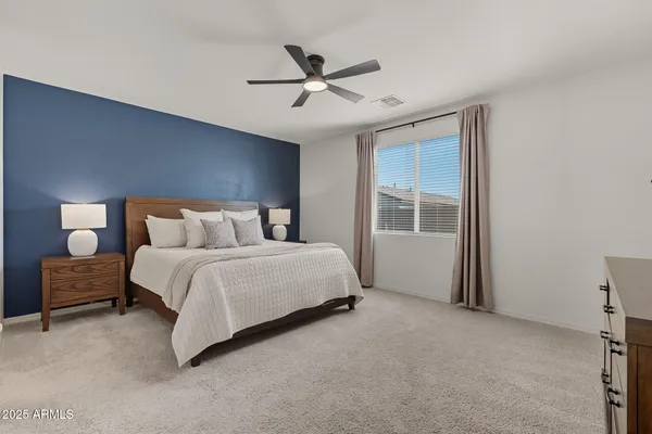 a bedroom with a bed and window