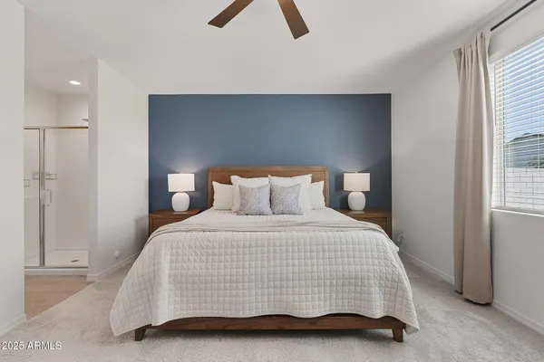 a bedroom with a bed and a night stand