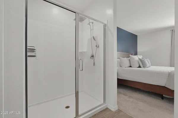 a bedroom with a bed and a closet