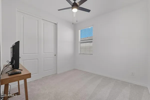 a view of room with workspace and a window