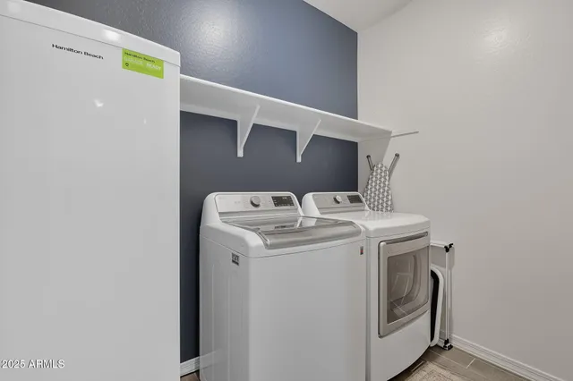 a utility room with dryer and washer