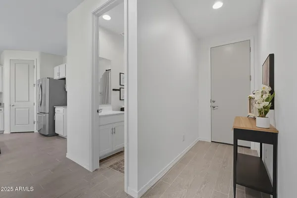 a view of a backyard with plants and a patio