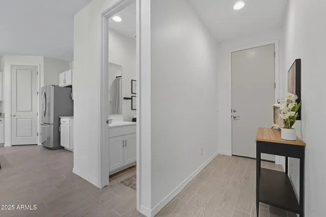 a view of a backyard with plants and a patio