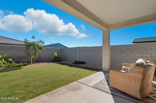 a bedroom with a white bed and a couch