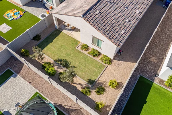 an aerial view of a house with a garden