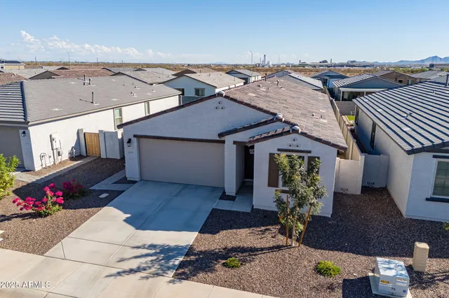 an aerial view of residential houses with outdoor space
