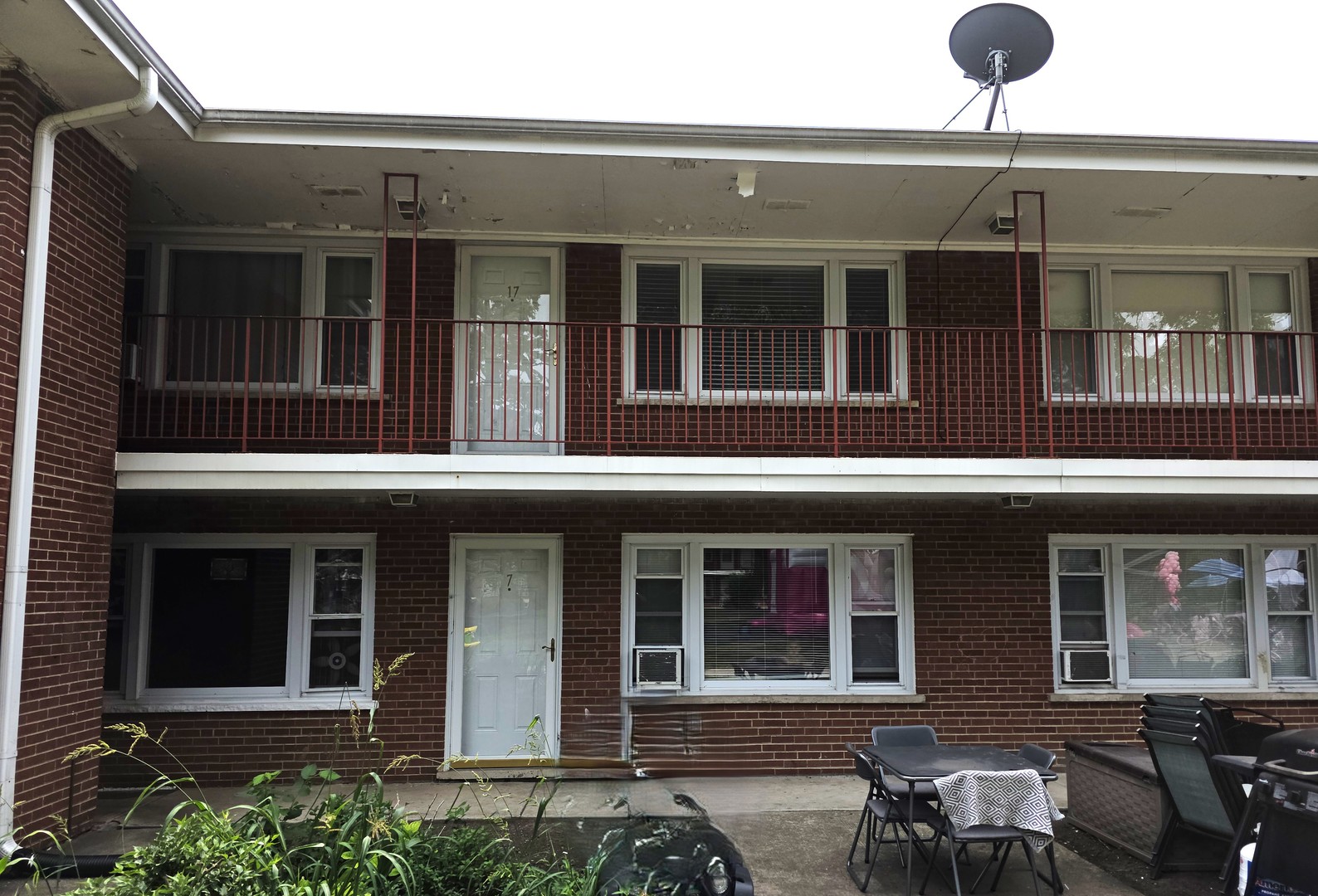 a view of a brick building with many windows