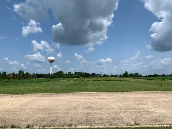 a view of a building and a big yard