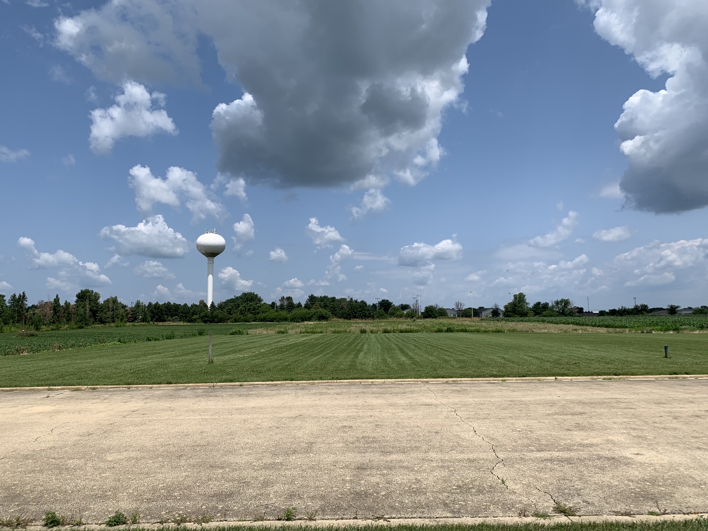 a view of a building and a big yard