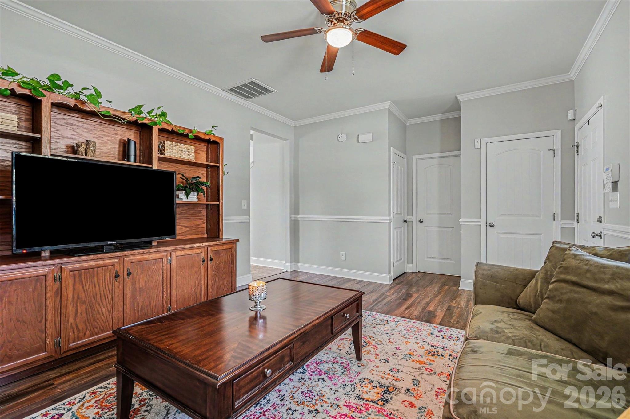 1610 Walter Hasty Road Monroe, NC 28110 - Photo 6 of 32 a living room with furniture and a flat screen tv