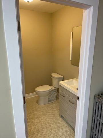 4157 West 26th Street Chicago, IL 60623 - Photo 5 of 5 a white toilet sitting next to a white sink