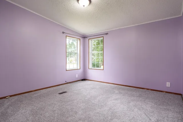 an empty room with closet area