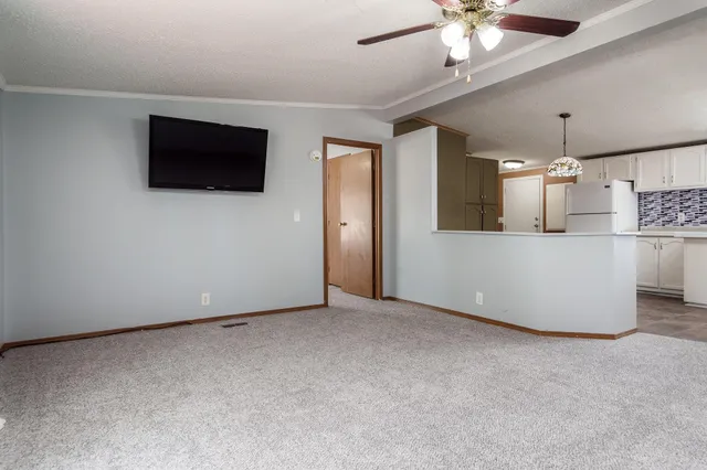 a view of a livingroom with a flat screen tv