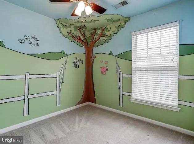 a view of a room with a window and chandelier