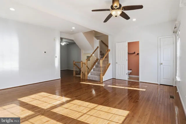 a view of an entryway with wooden floor
