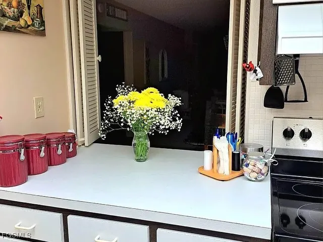 a kitchen with a sink and a stove