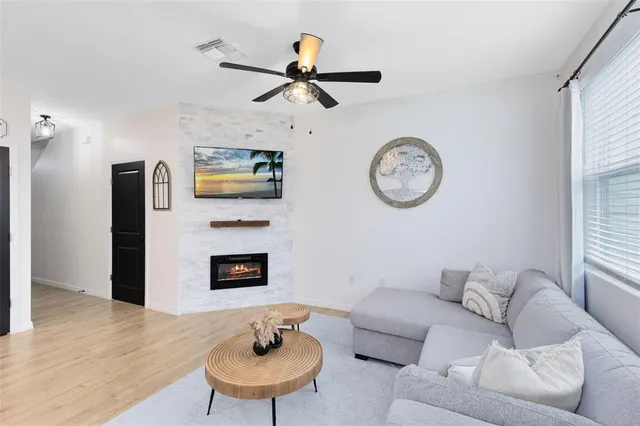 a living room with furniture and a fireplace