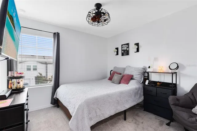 a bedroom with a bed and furniture