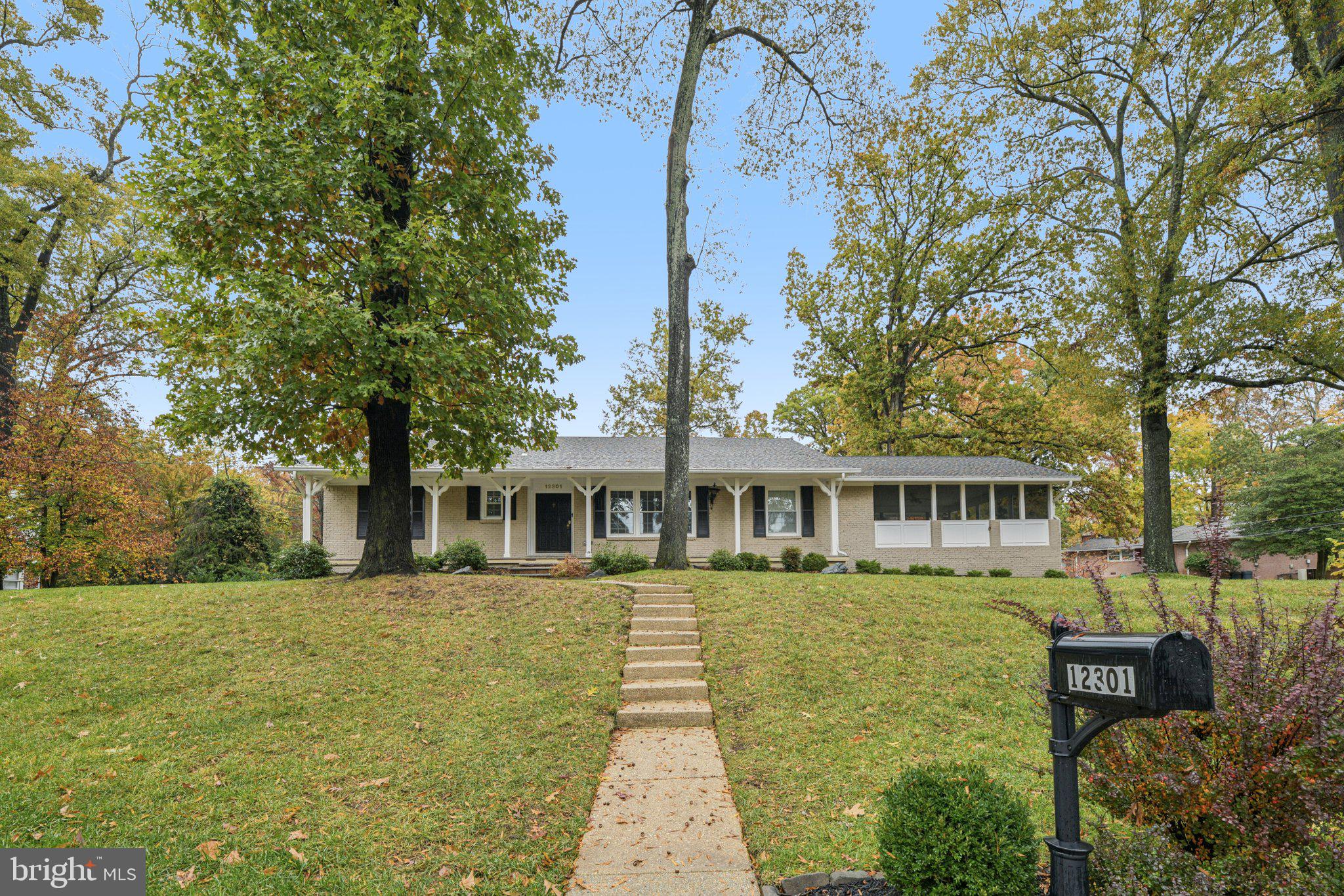 12301 Arrow Park Drive Fort Washington, MD 20744 - Photo 1 of 10 a front view of a house with a yard and lake view
