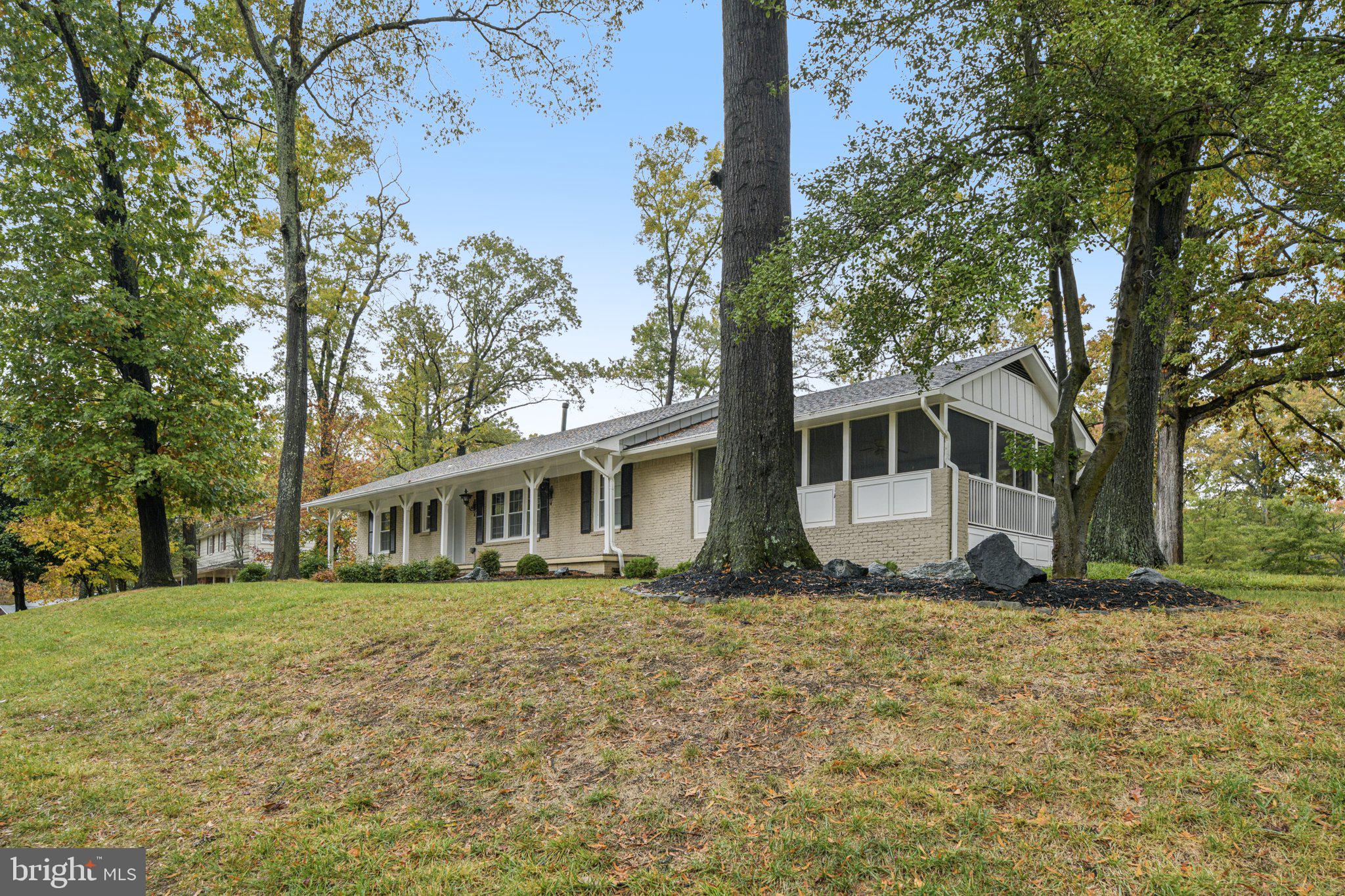 12301 Arrow Park Drive Fort Washington, MD 20744 - Photo 2 of 10 a house that has a tree in front of it