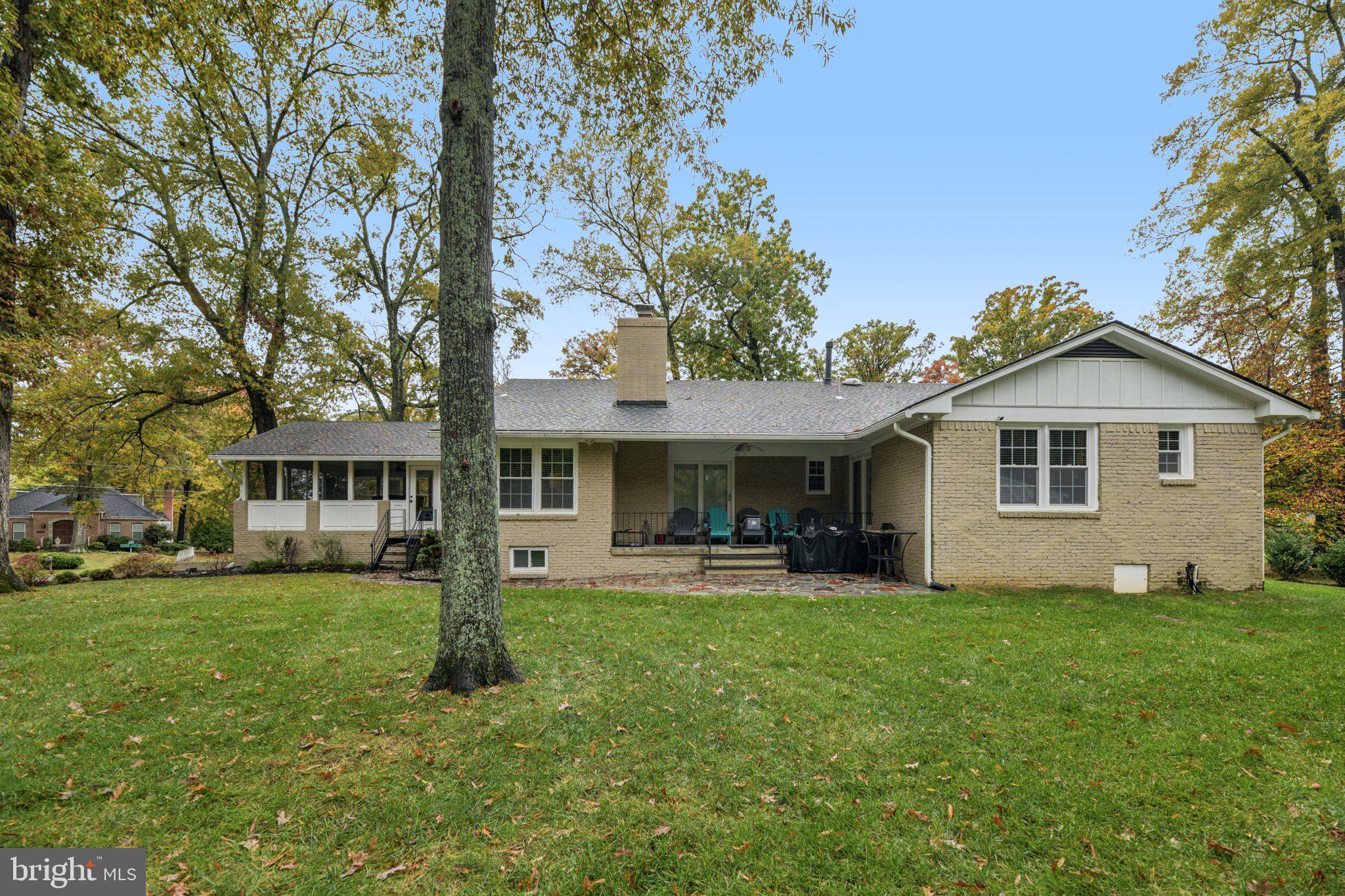12301 Arrow Park Drive Fort Washington, MD 20744 - Photo 8 of 10 a front view of a house with a yard and trees