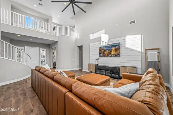 a kitchen with stainless steel appliances granite countertop a stove a sink dishwasher and cabinets with wooden floor