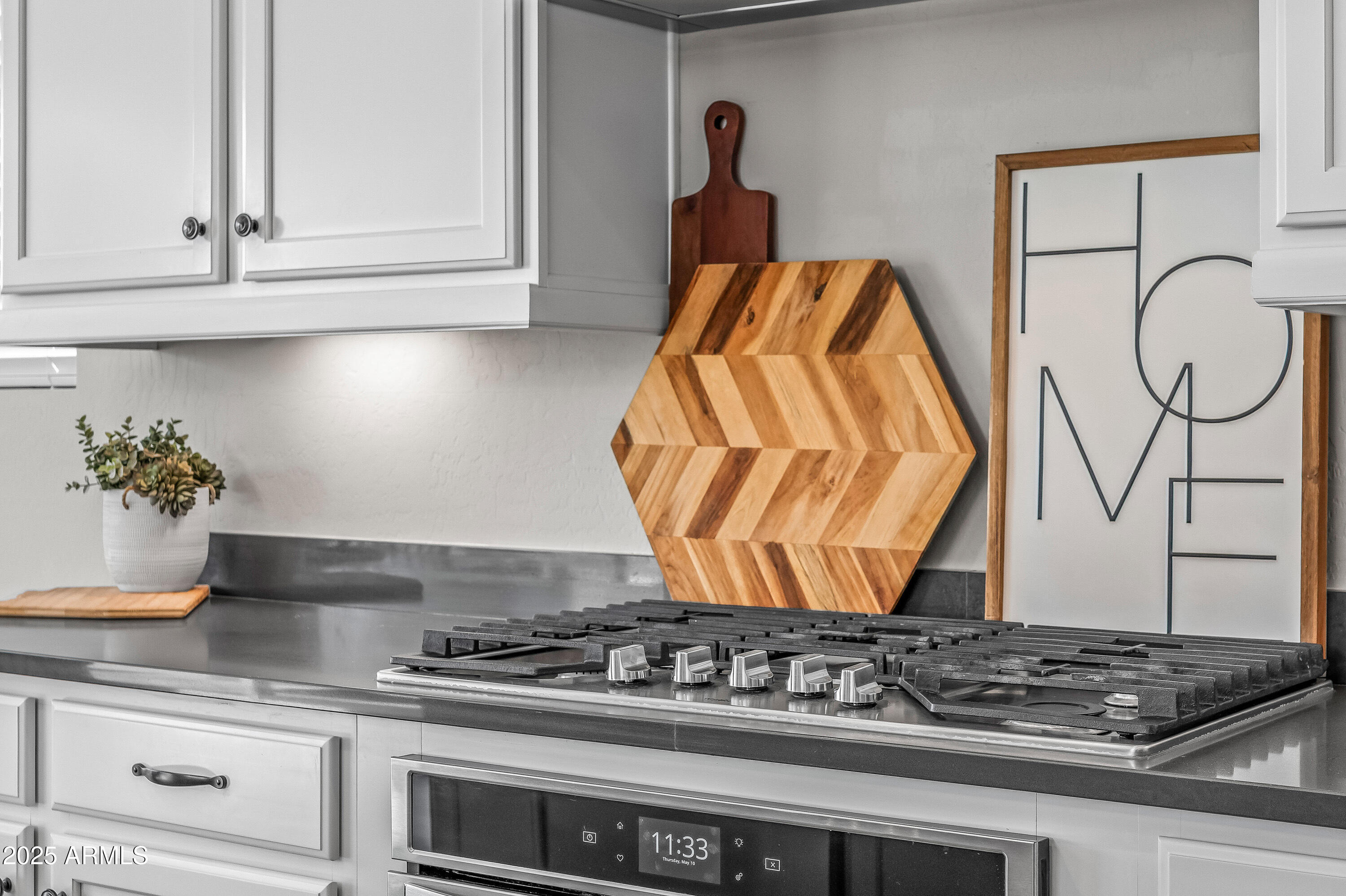 22211 North 31st Street Phoenix, AZ 85050 - Photo 16 of 94 a kitchen with white cabinets and appliances