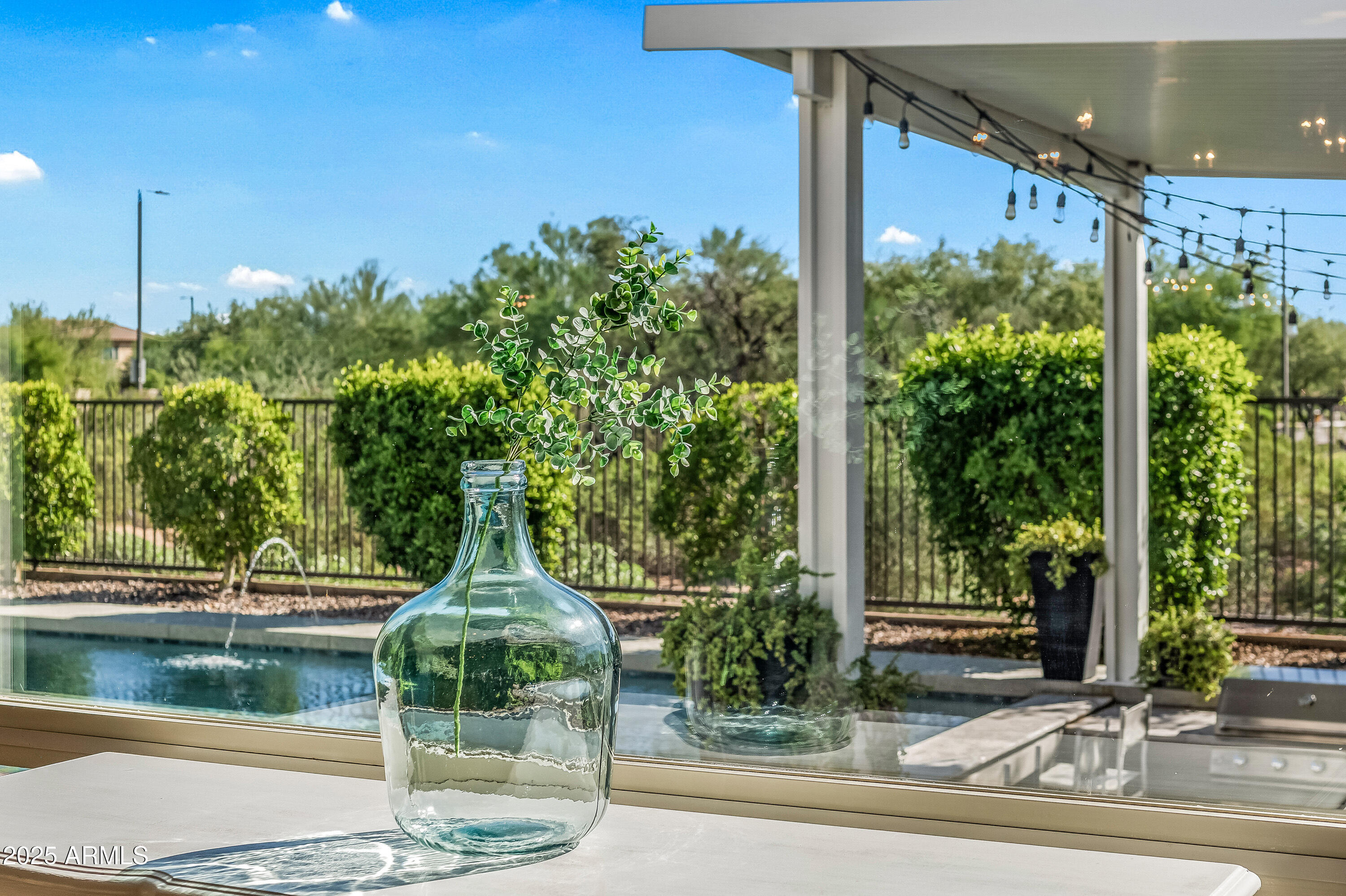 22211 North 31st Street Phoenix, AZ 85050 - Photo 19 of 94 a glass vase sitting on top of a yard
