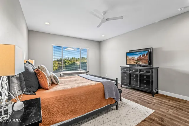 a kitchen with stainless steel appliances granite countertop a sink a refrigerator and a stove