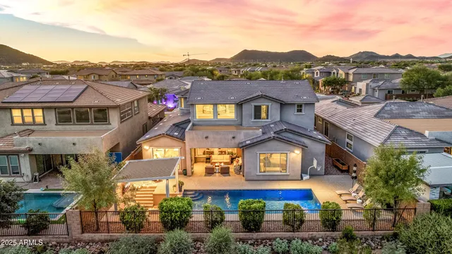 a kitchen with stainless steel appliances granite countertop a kitchen island a stove a table and chairs in it