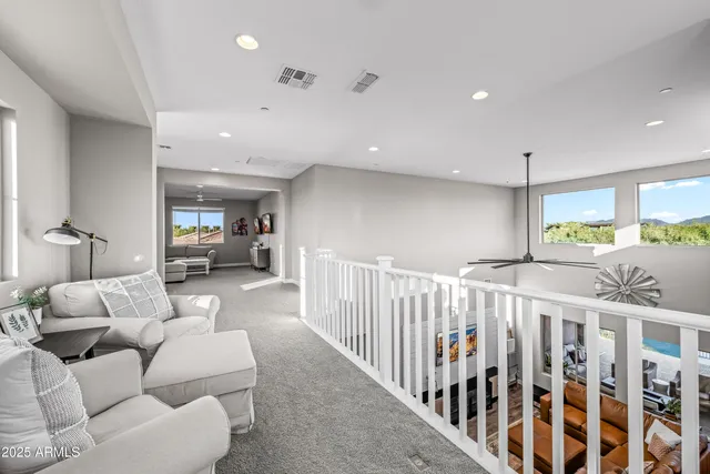 a bedroom with furniture and wooden floor