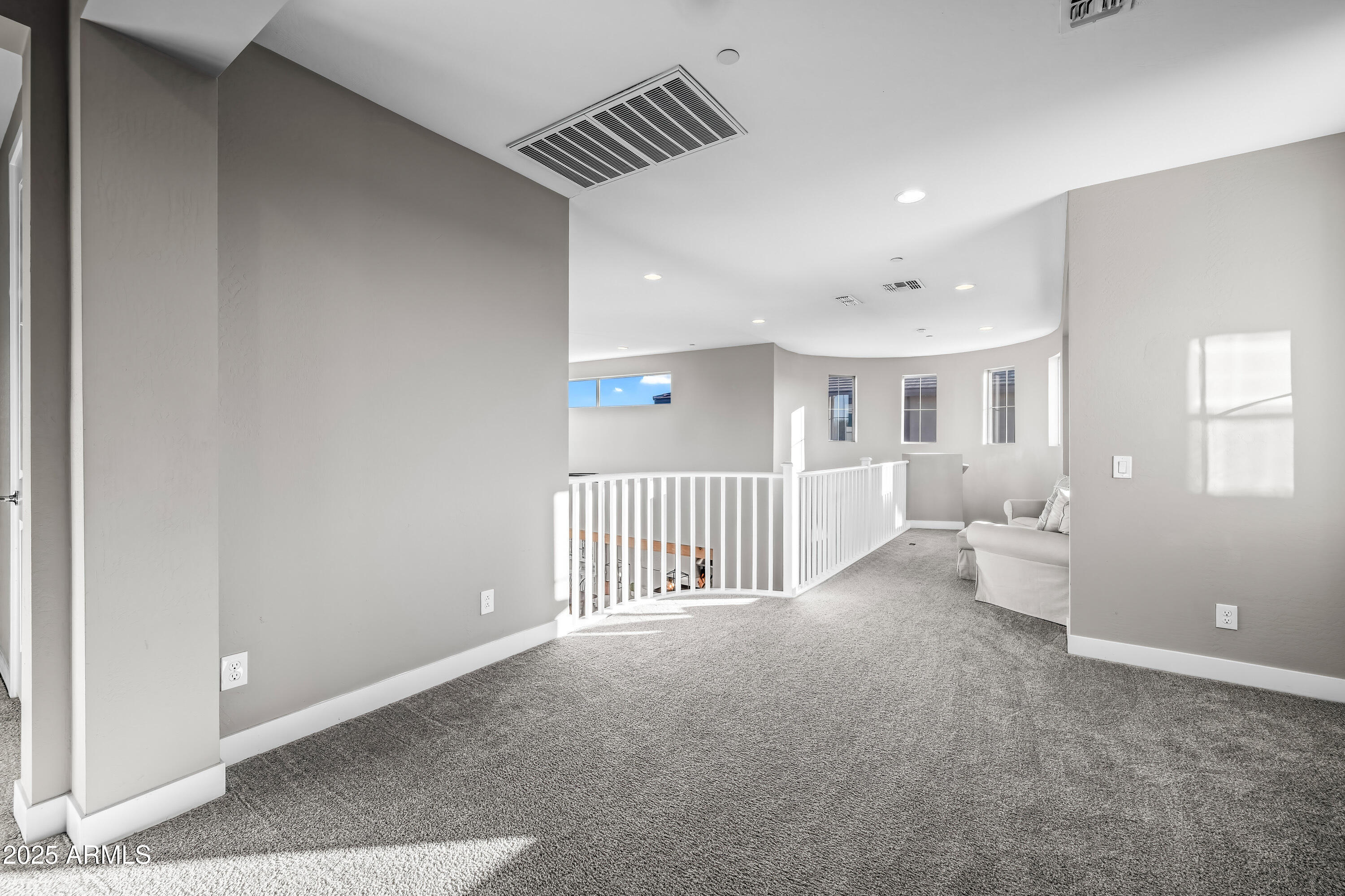 22211 North 31st Street Phoenix, AZ 85050 - Photo 32 of 94 a view of a hallway with a bedroom and a window