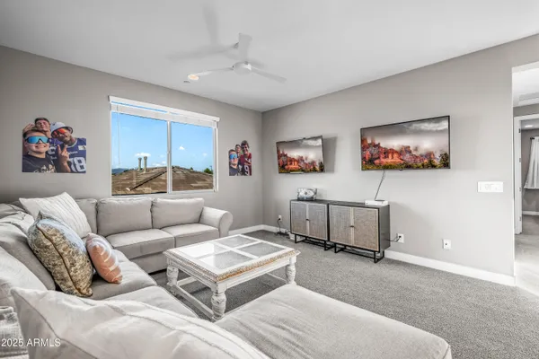 a kitchen with stainless steel appliances granite countertop a sink a refrigerator and a stove