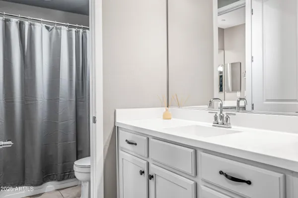a bedroom with furniture and wooden floor