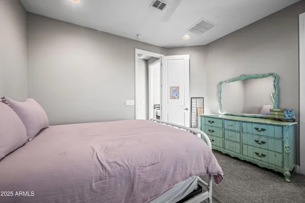 a kitchen with stainless steel appliances granite countertop a stove a sink dishwasher and a refrigerator with wooden floor