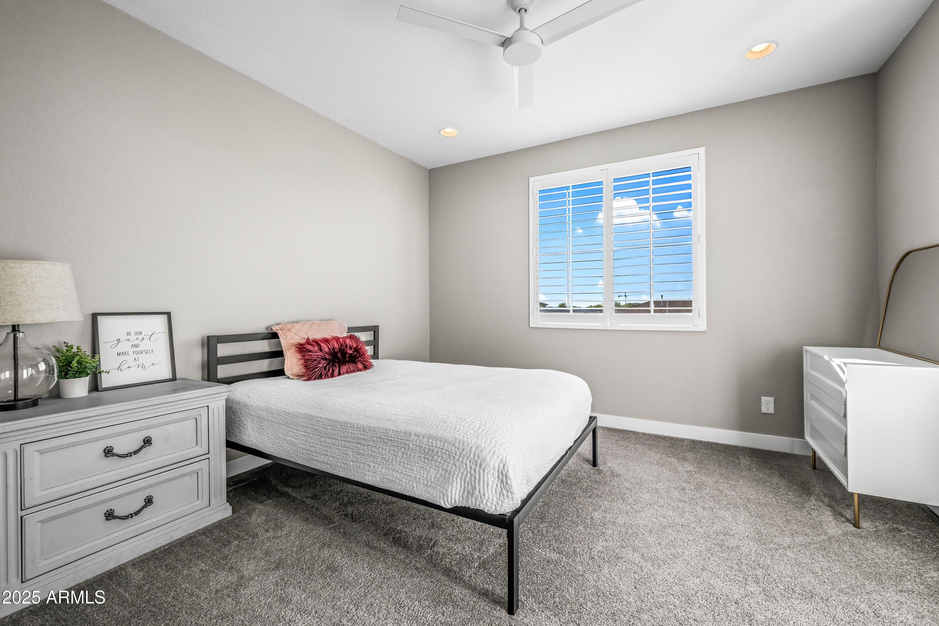 22211 North 31st Street Phoenix, AZ 85050 - Photo 42 of 94 a bedroom with a bed and a dresser