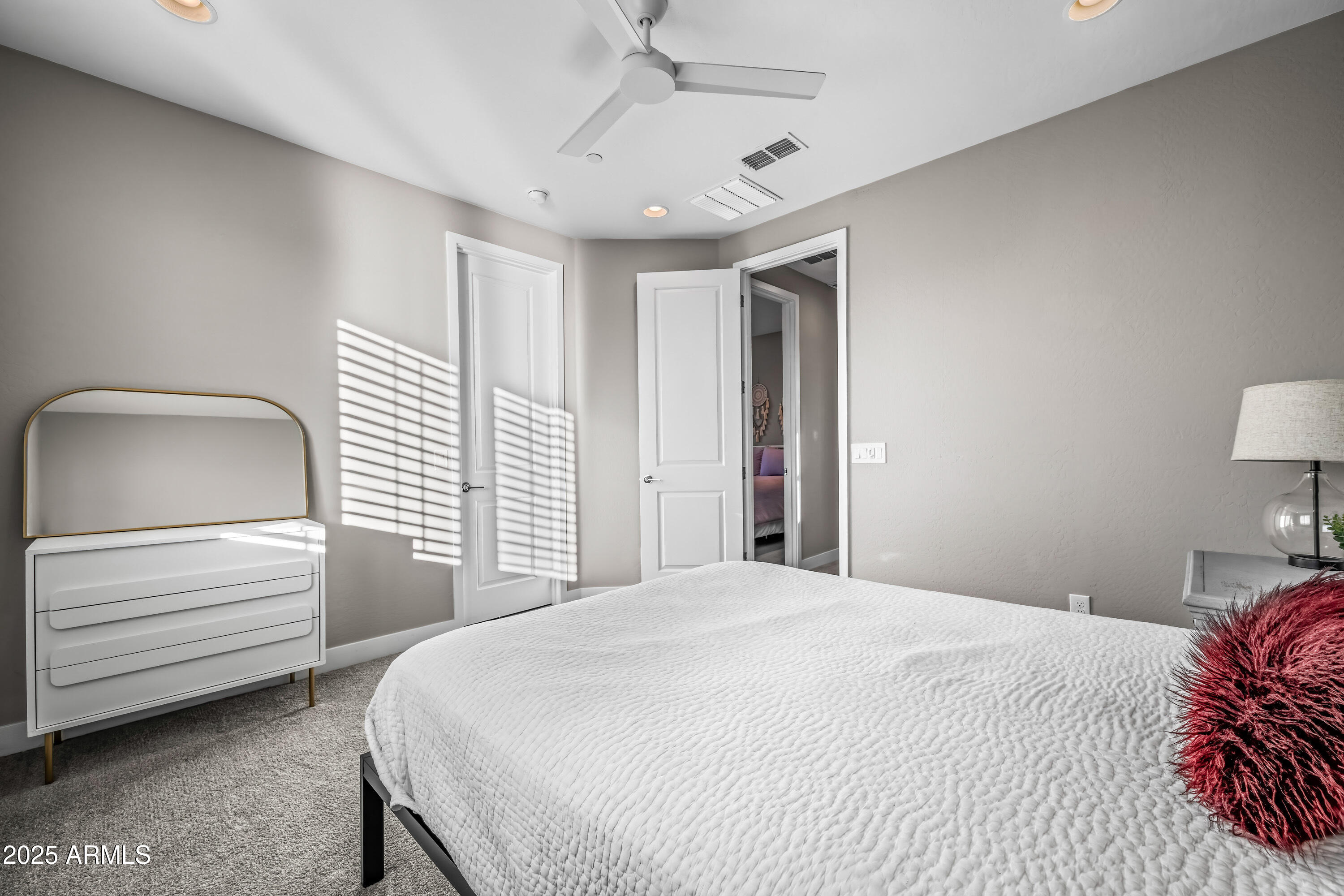 22211 North 31st Street Phoenix, AZ 85050 - Photo 43 of 94 a bedroom with a bed and a dresser